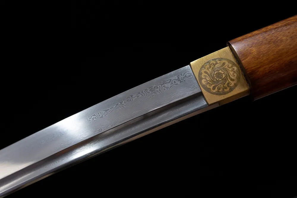 Upper T10 clay‑tempered wakizashi blade brass habaki notare‑gunome undulating hamon temper‑line macro close‑up