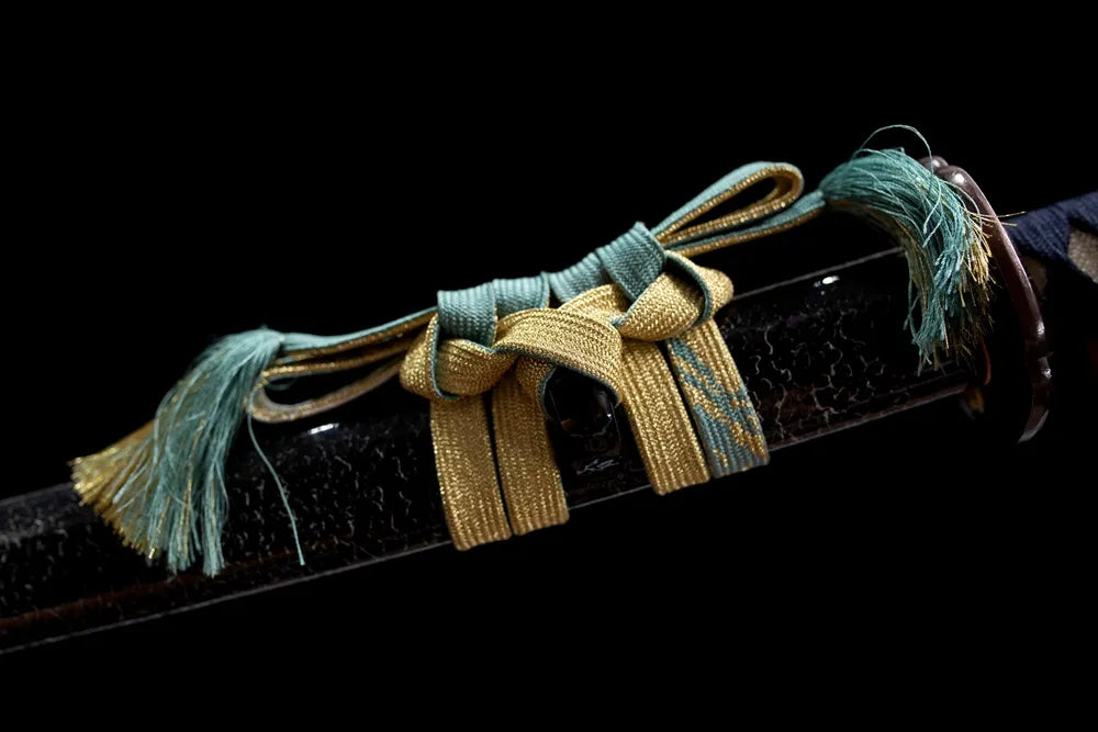 Thick dark‑purple mixed‑thread braided sageo cord brass‑alloy fitting macro close‑up