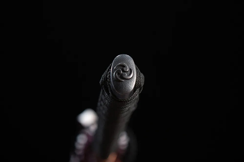 Smooth matte black iron pommel cap detail