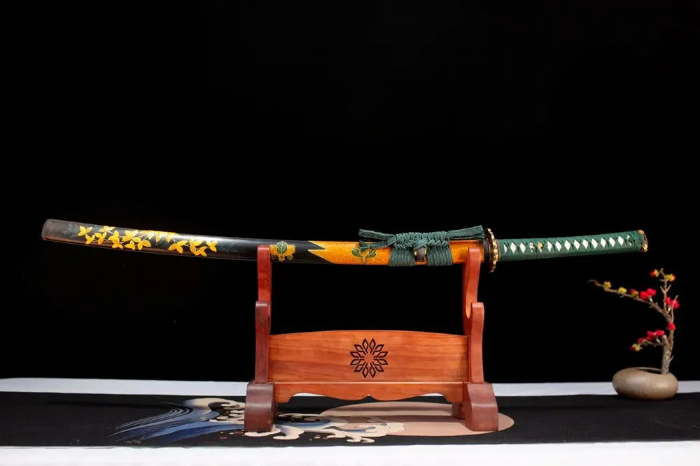 Horizontal laid closed black‑gold‑gradient golden‑maple‑leaf Late‑Autumn‑Katana scabbard flat table‑top front display