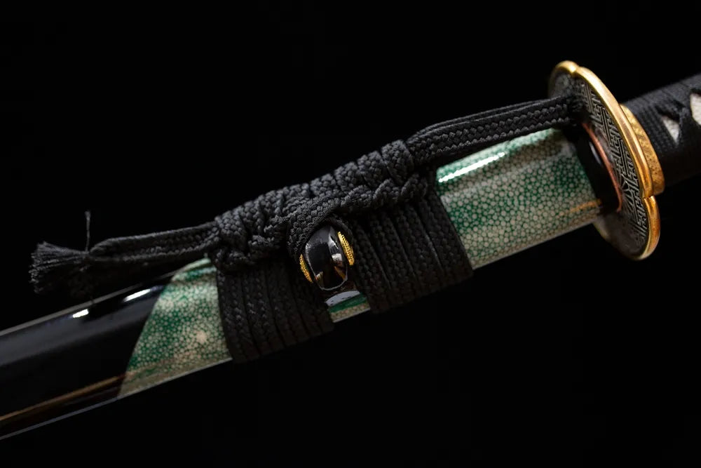 Thick dark‑olive‑green braided sageo cord copper gilded‑silver fitting macro close‑up