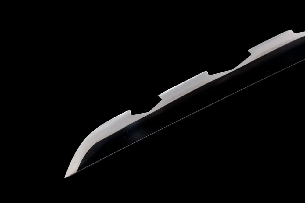 Sharp serrated kissaki tip of Hashibira Inosuke blade front close view