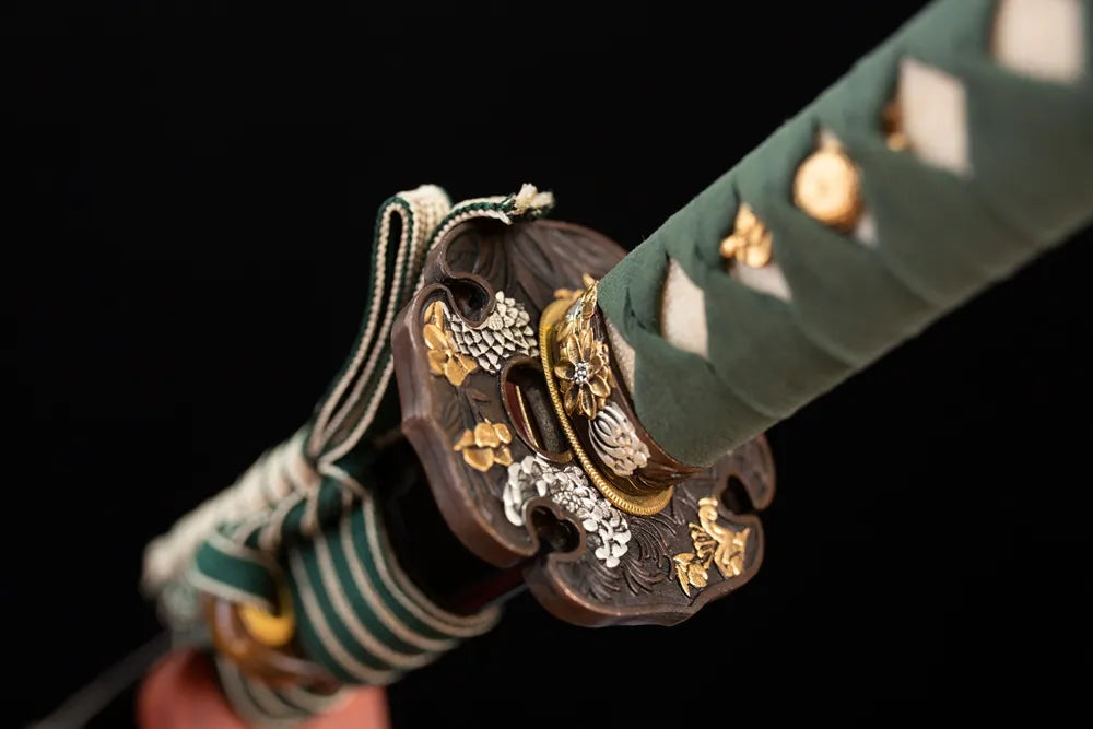 Reverse‑side wind‑bell‑cloud‑scroll carving aged‑copper tsuba surface texture close‑up