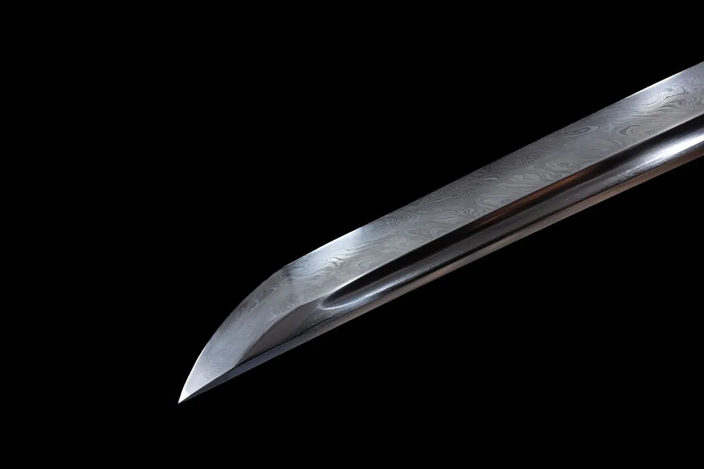Sharp classic kissaki damascus blade tip close view