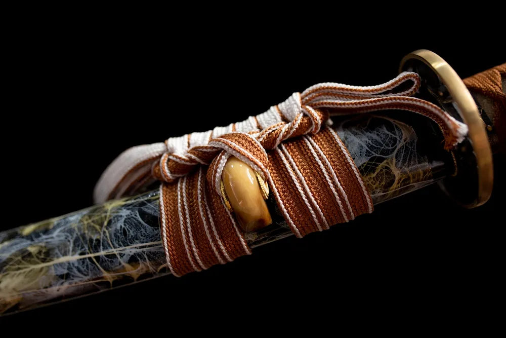 Thick brown‑white mixed braided sageo cord brass‑alloy fitting macro close‑up