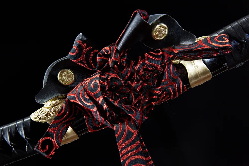Red black swirl pattern woven cotton sageo cord tied on brass saya ring