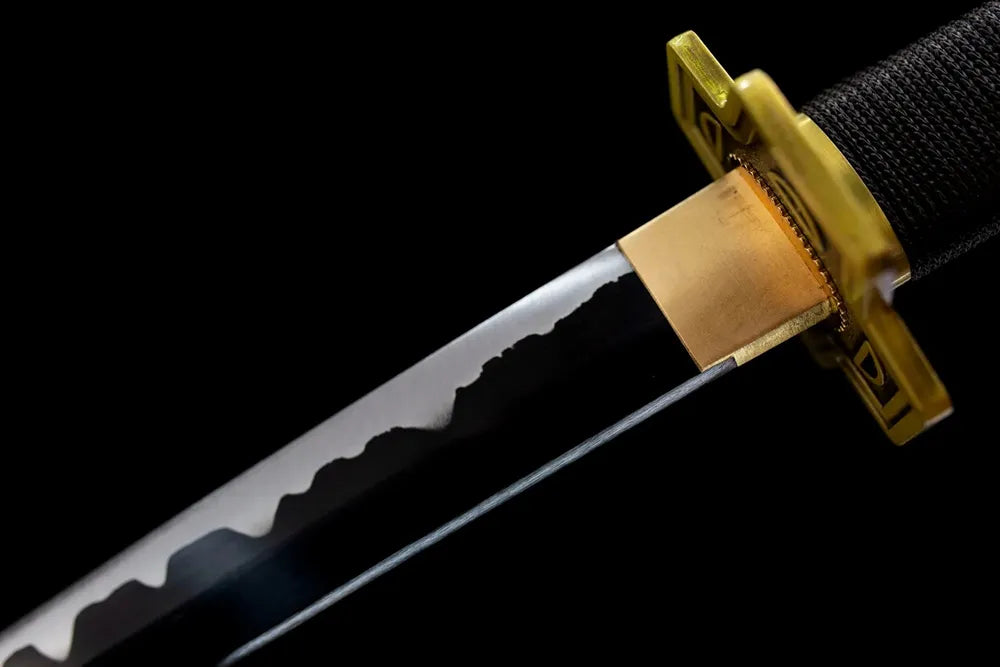 Upper oil‑quenched blade antique brass habaki macro close‑up