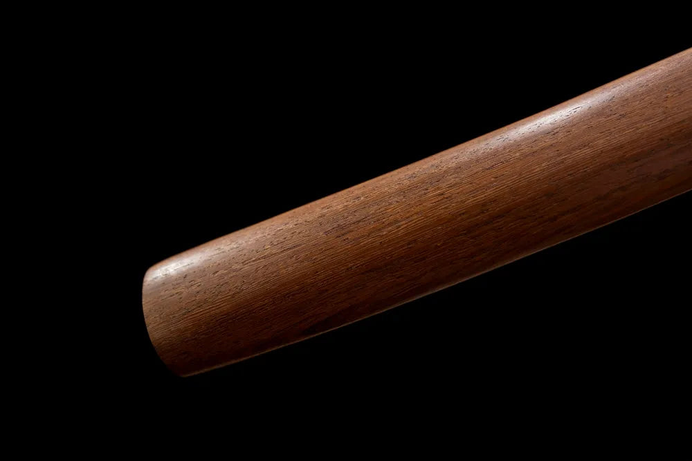 Bottom matte‑brown practical saya antique‑bronze alloy kojiri end‑cap close‑up