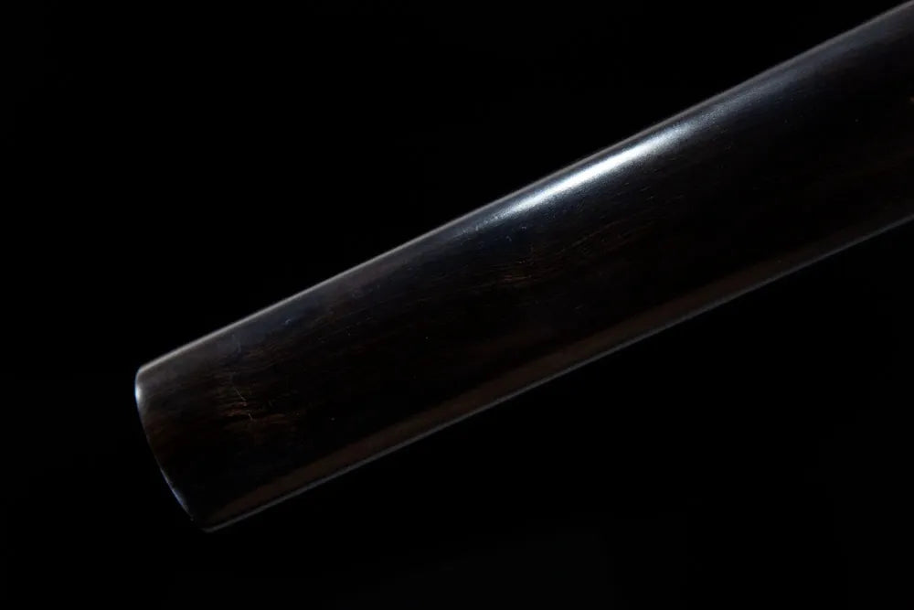 Bottom end carved wood saya