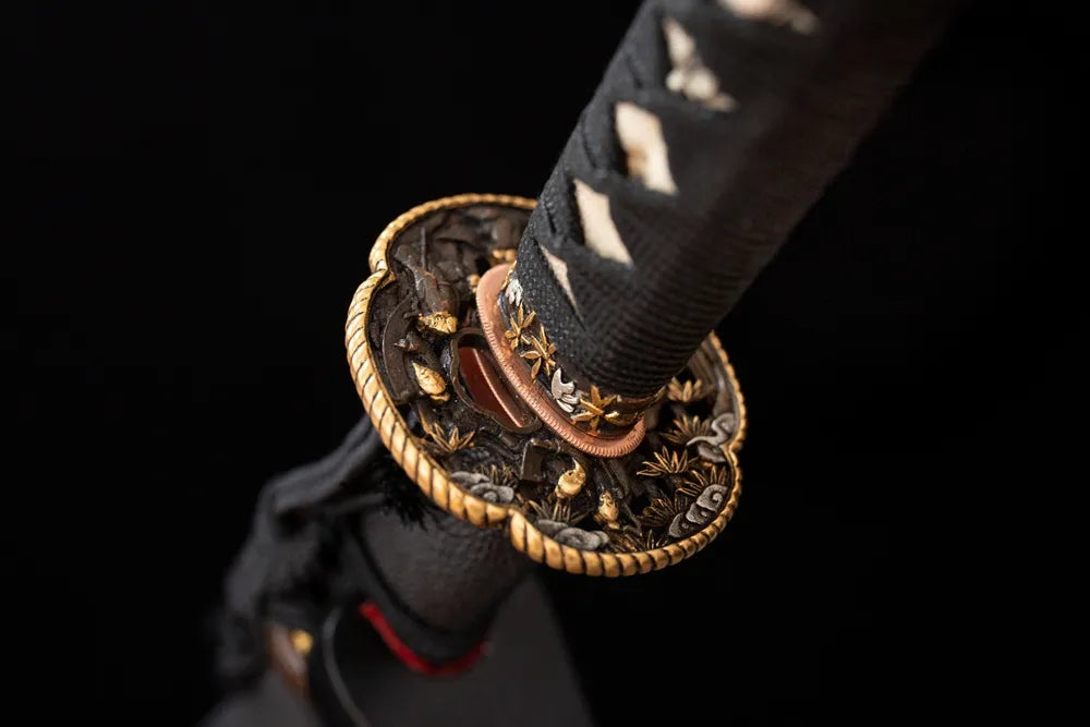 Reverse‑side subtle warrior‑scroll engraving copper‑gilded‑silver tsuba surface texture close‑up