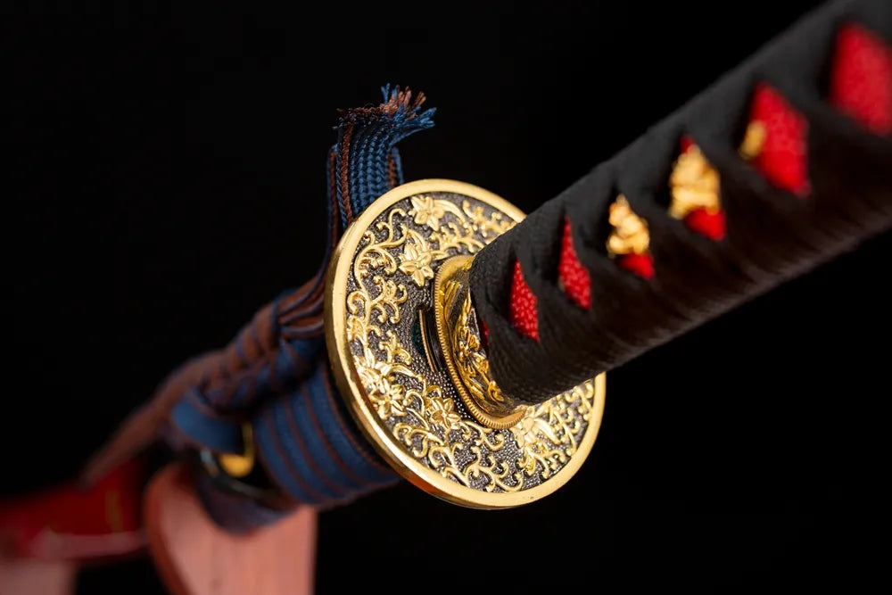 Reverse‑side floral‑scroll carving gold‑plated‑alloy tsuba surface texture close‑up
