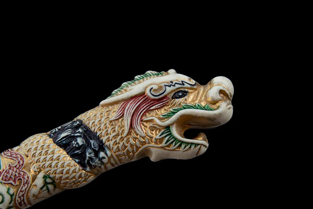 Upper tsuka closeup large sculpted dragon head multi-color paint detail