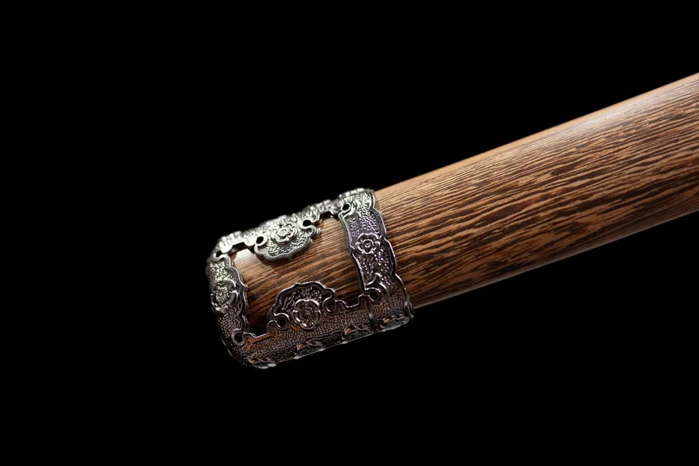 Bottom vintage wood‑grain saya brass‑alloy kojiri end‑cap close‑up