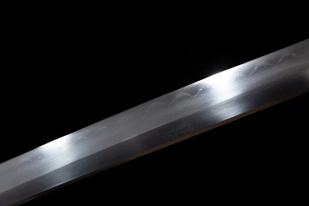 Mid‑section clean suguha plain‑straight‑pattern hamon steel katana blade surface close‑up shot