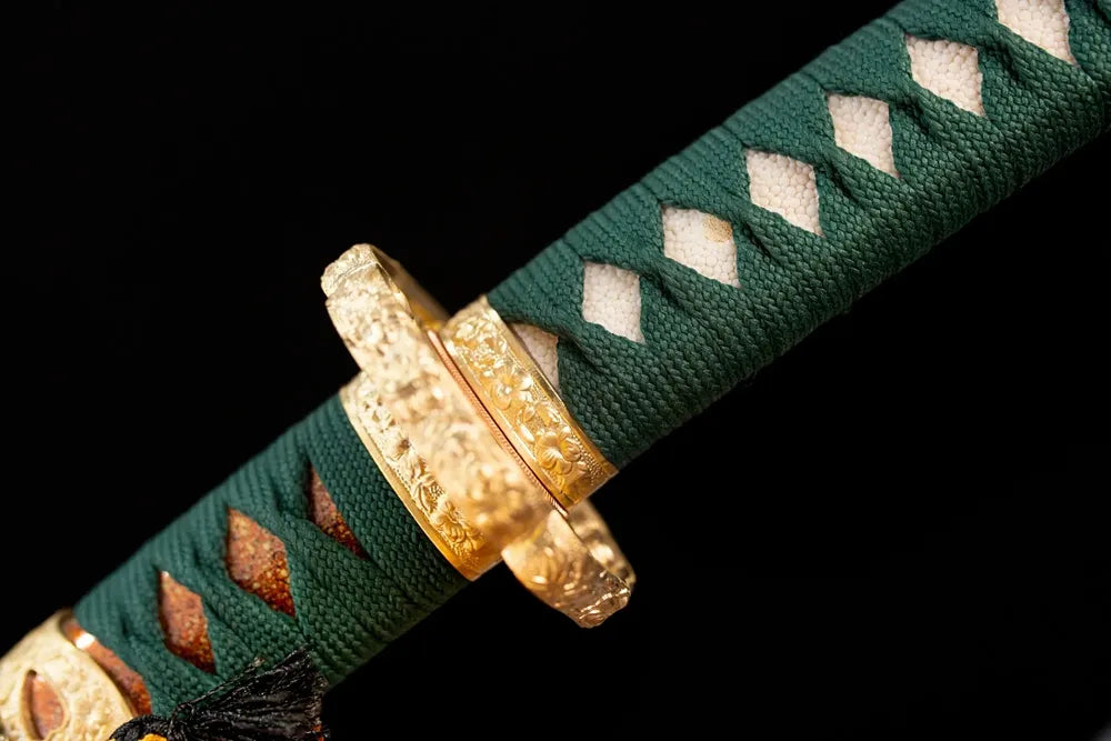 Clan‑crest‑kamon‑cherry‑chrysanthemum‑relief gilded‑alloy fuchi grip‑ring macro close‑up