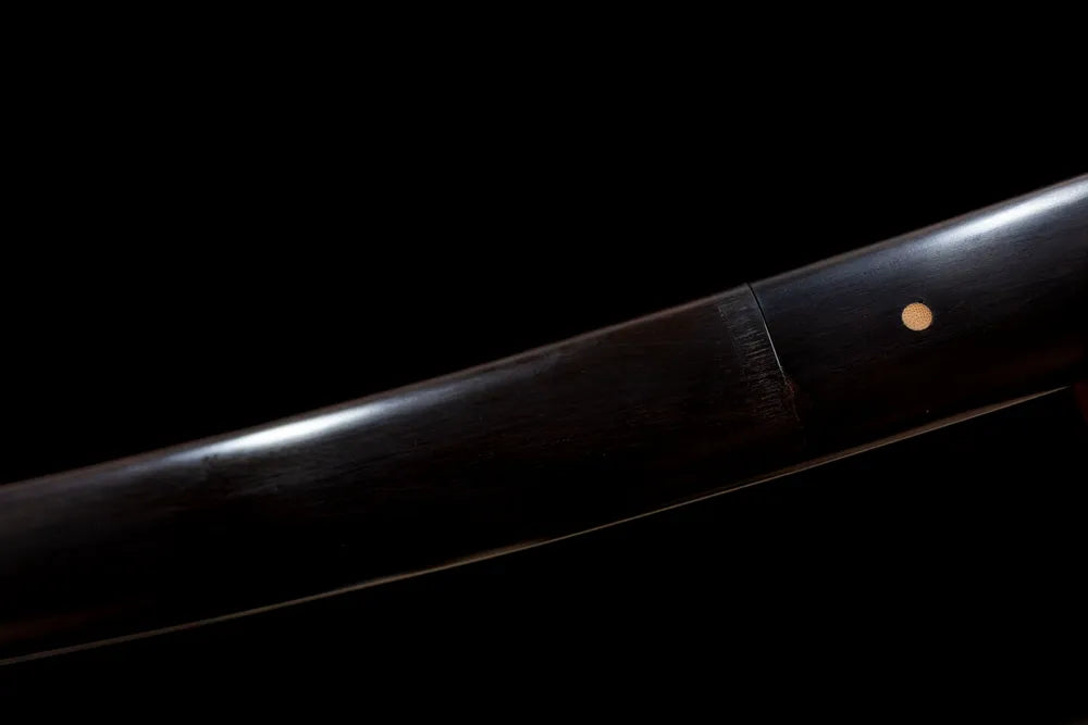 Mid‑section light‑gray lacquer hardwood wakizashi saya silver‑feather graphic‑print texture close‑up