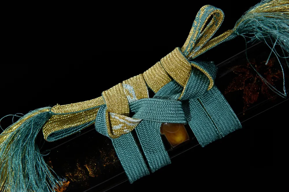 Scarlet thick cotton sageo cord tied on ox horn saya ring