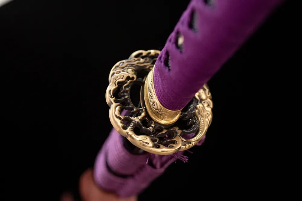 Reverse‑side wind‑thunder‑deity cloud carving vintage‑gild tsuba surface texture close‑up