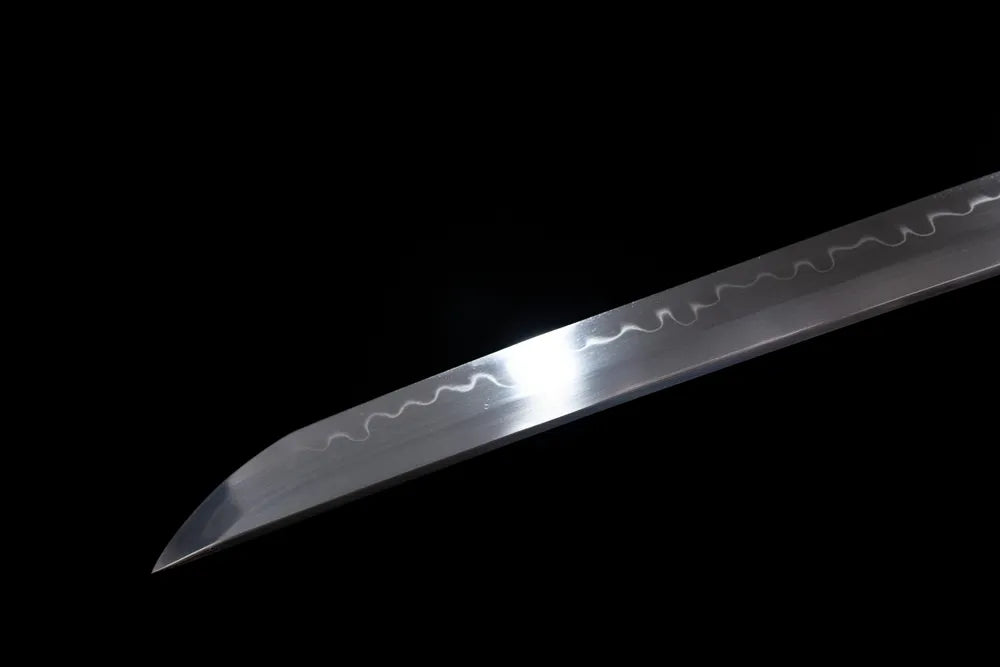 Classic functional katana‑style kissaki tip of Comet‑Katana blade close‑up view