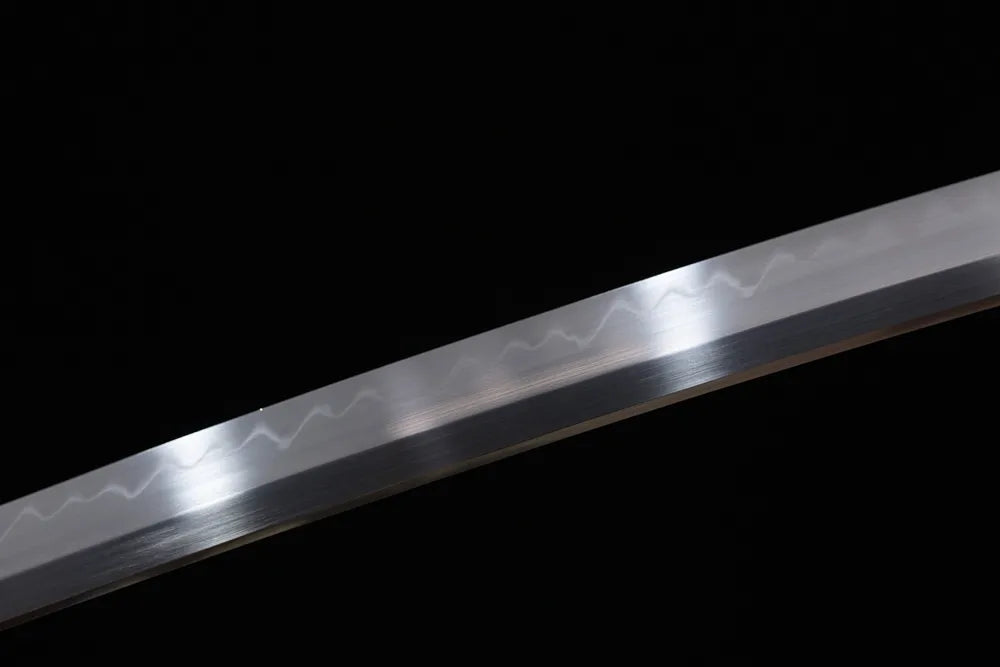 Mid‑section sanbonsugi three‑peak hamon steel long katana blade surface close‑up shot
