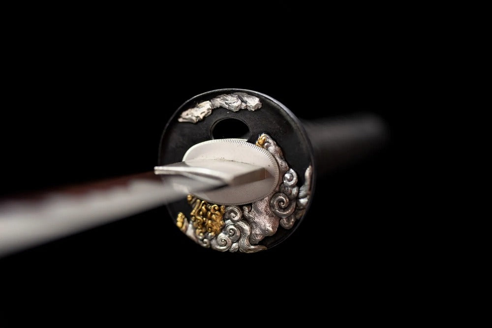 Front ornate lion‑shishi relief mixed gold‑silver copper‑alloy samurai hand‑guard close‑up