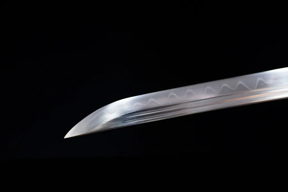 Classic functional katana‑style kissaki tip of Day‑Night‑Katana blade close‑up view