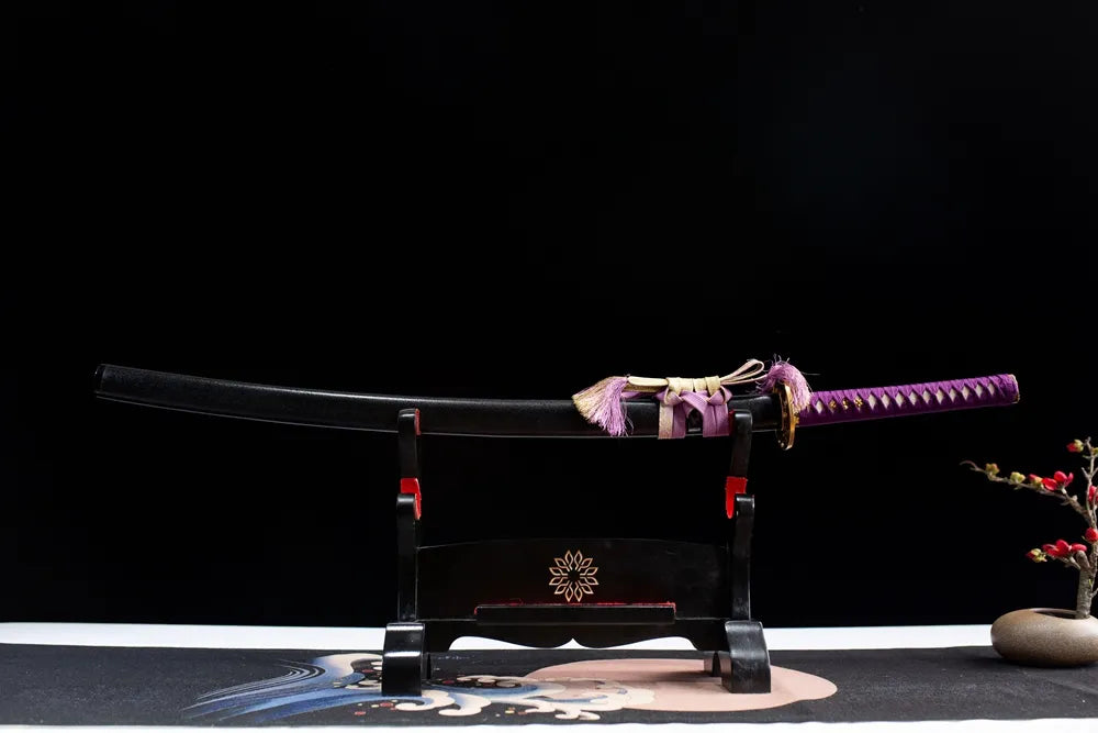 Horizontal laid closed black scabbard clover floral samurai sword