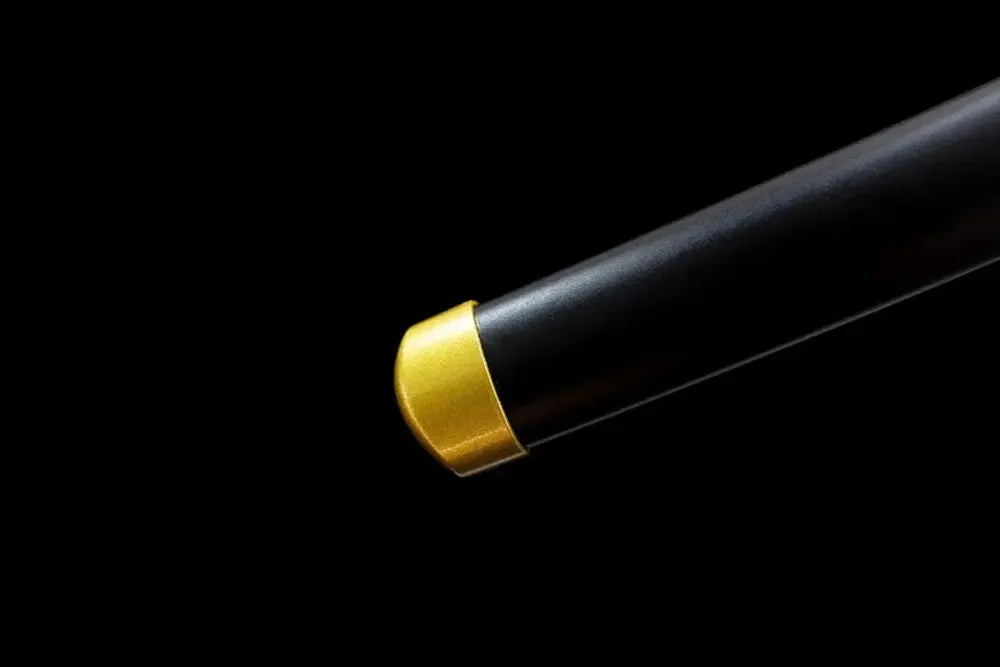 Bottom smooth pale scabbard metal end cap close‑up