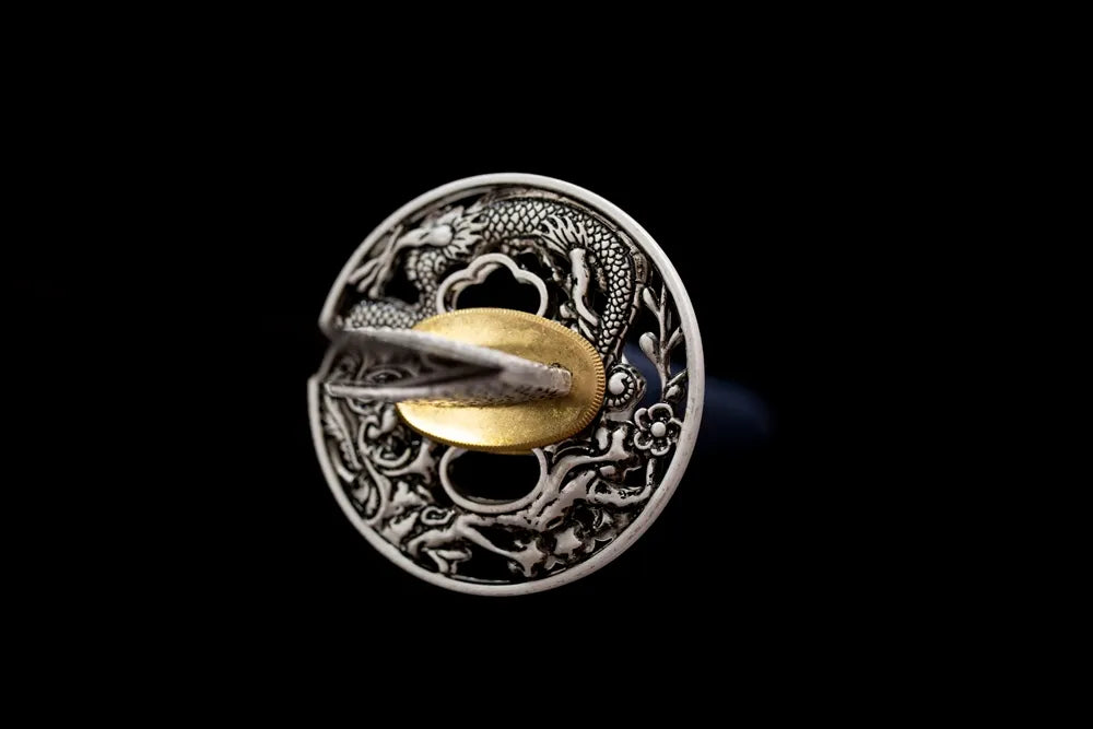 Front hollow‑open‑work dragon‑plum‑blossom alloy samurai hand‑guard close‑up