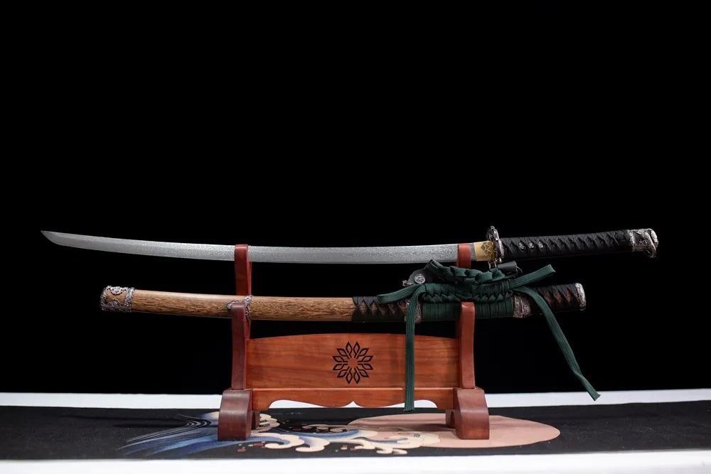 Flat fully‑drawn multi‑layer damascus oil‑quenched Night‑Eagle‑Tachi blade wooden rack front shot