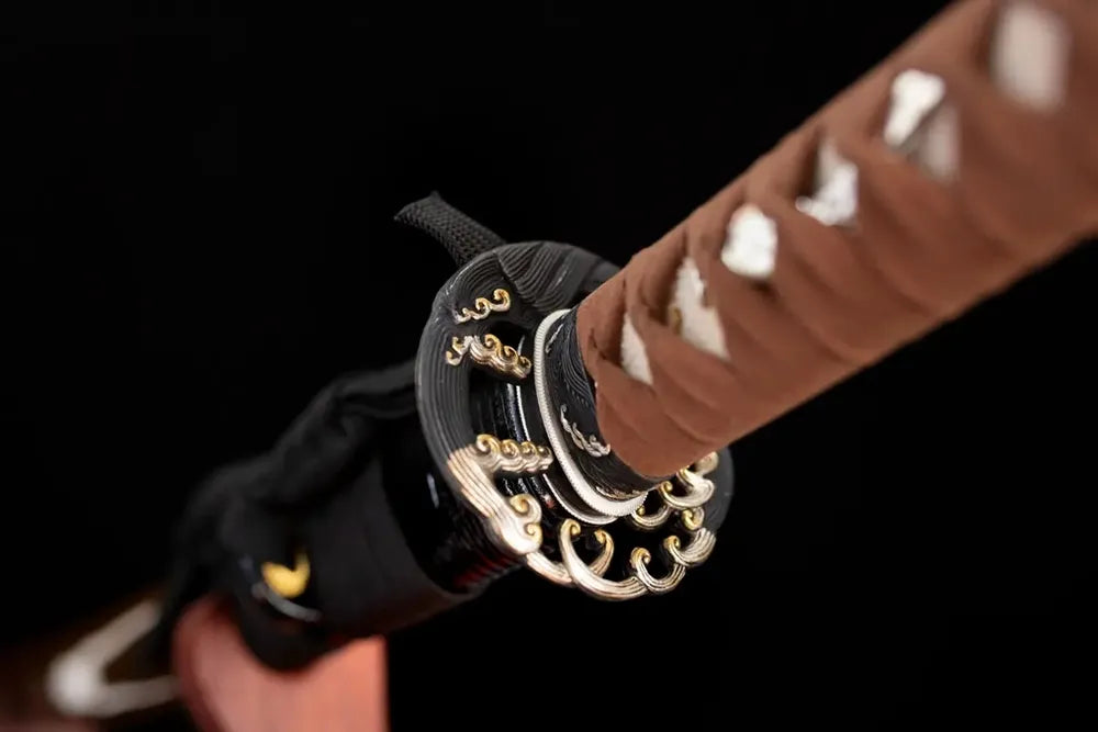 Reverse‑side ocean‑wave‑flow‑scroll carving aged‑copper tsuba surface texture close‑up