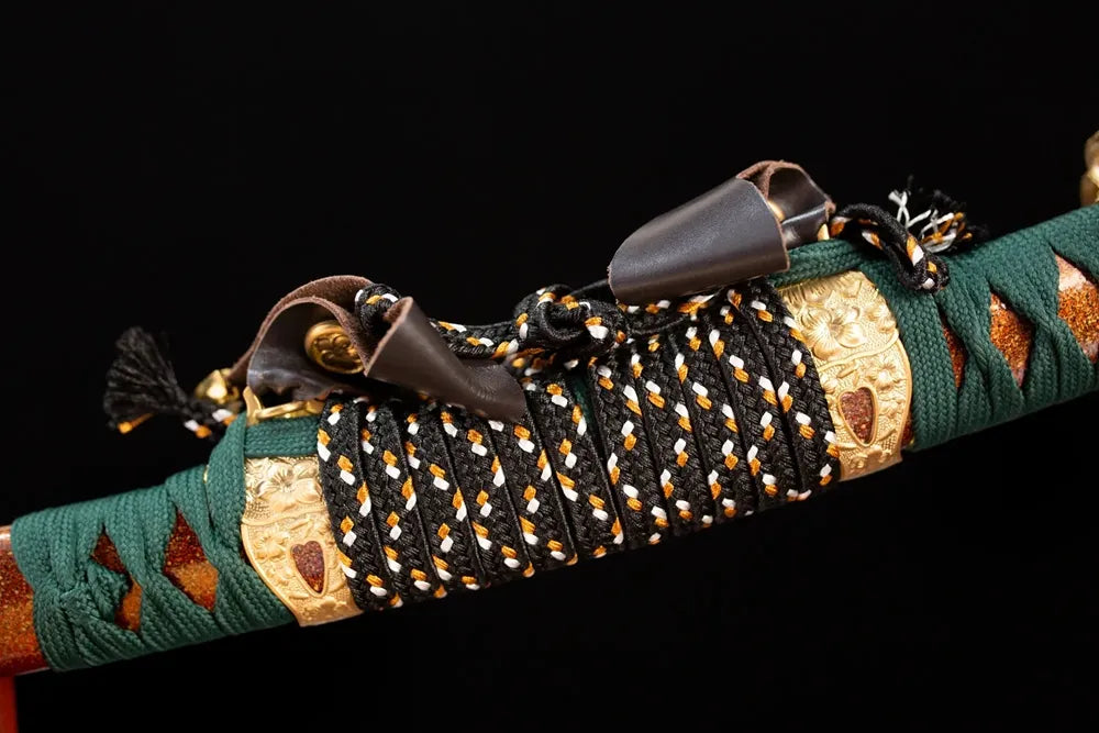 Thick black‑gold mixed‑braided sageo cord gilded‑alloy fitting macro close‑up