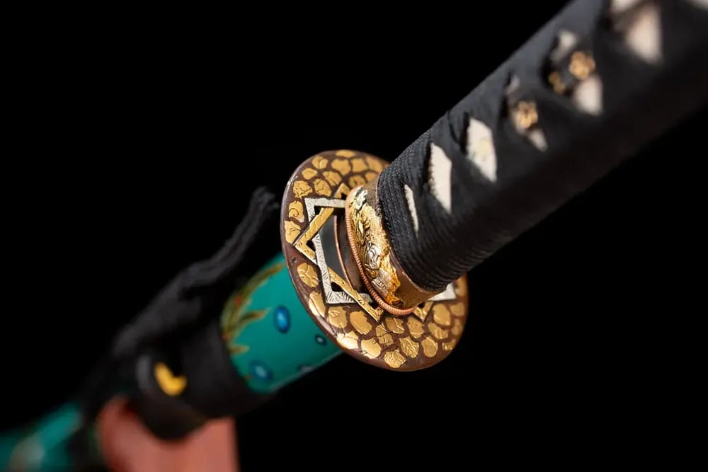 Reverse‑side peacock‑plume‑scroll carving gold‑silver‑plated copper tsuba surface texture close‑up