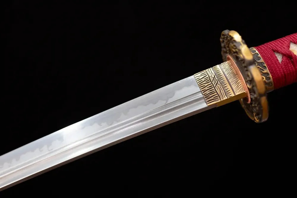Upper T10 oil‑quenched katana blade copper habaki sanbonsugi three‑cedar‑tree hamon temper‑line macro close‑up