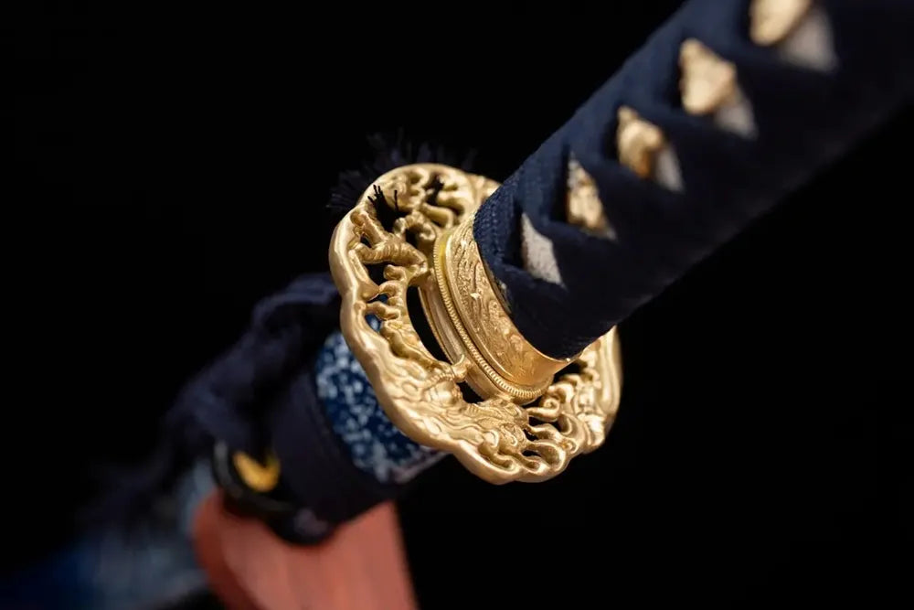 Reverse‑side oni‑demon‑ghost‑scroll carving gilded‑copper tsuba surface texture close‑up‑compact tsuba