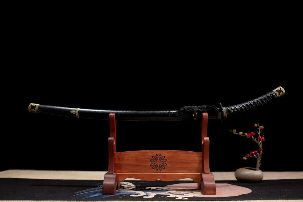 Horizontal laid closed full matte‑black pattern‑free Black‑Tachi‑Sword scabbard flat table‑top front display