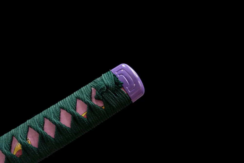 Top purple alloy kashira pommel front close‑up