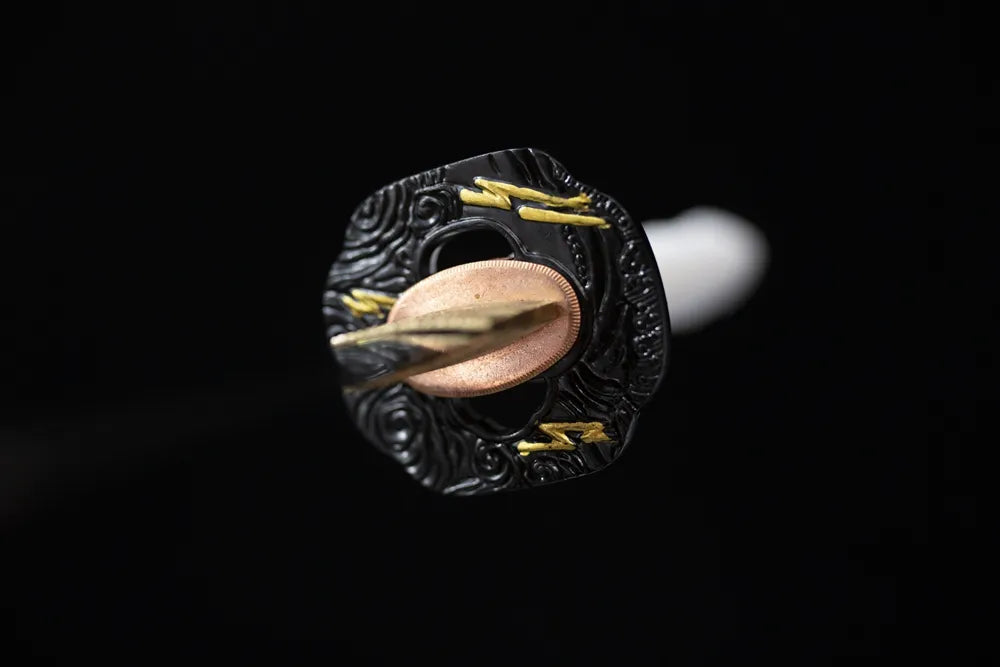 Reverse‑side cloud‑carving black‑gold aged‑alloy tsuba surface texture close‑up long katana