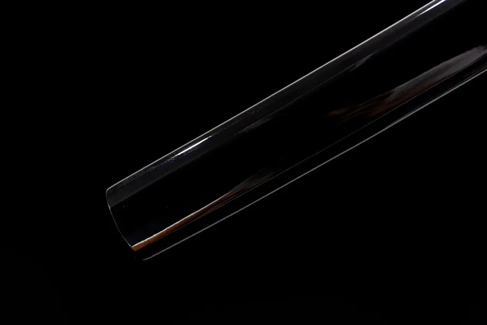 Bottom part black saya polished end‑cap close‑up
