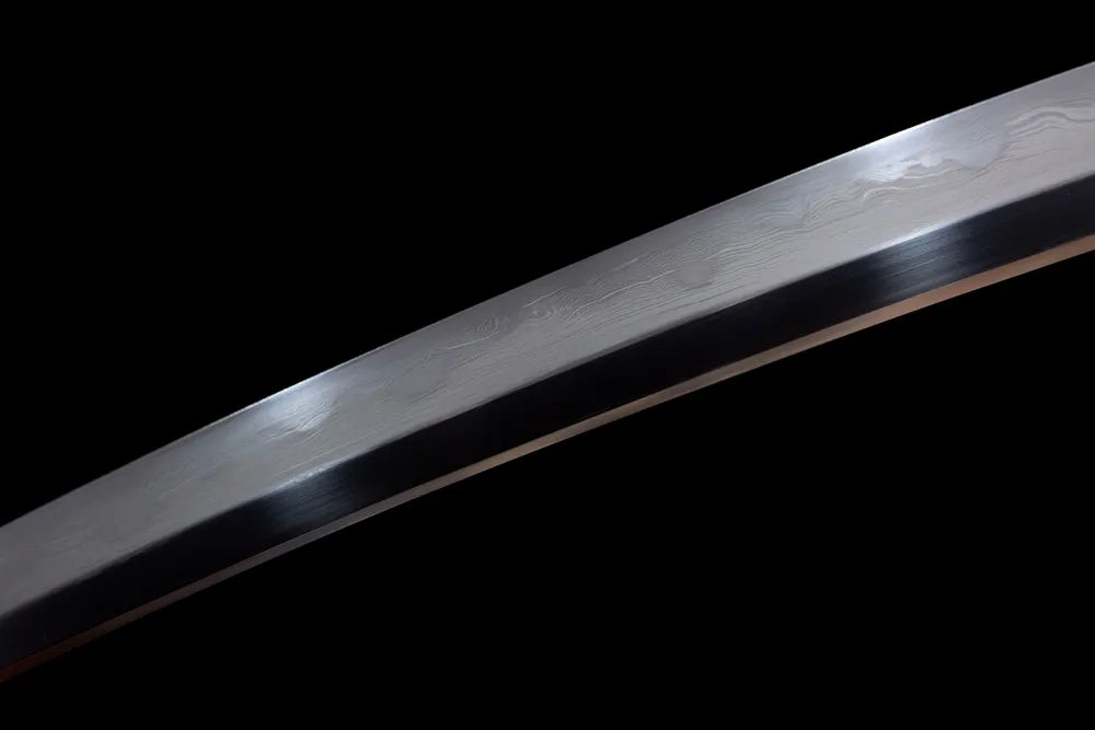 Mid‑section suji‑gunome mixed‑pattern hamon steel wakizashi blade surface close‑up shot