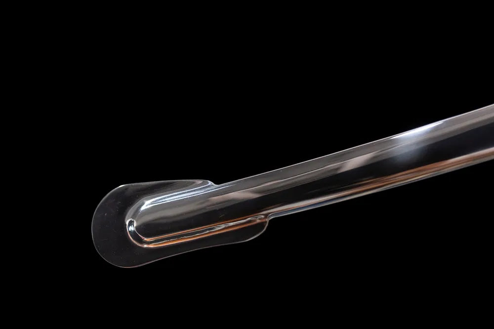 Bottom mirror‑polished metal scabbard rounded metal chape end‑cap close‑up