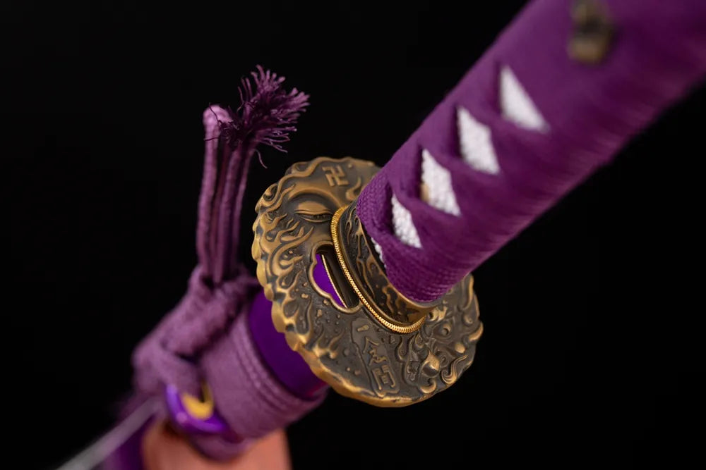 Reverse‑side drifting‑cloud‑scroll carving aged‑copper tsuba surface texture close‑up