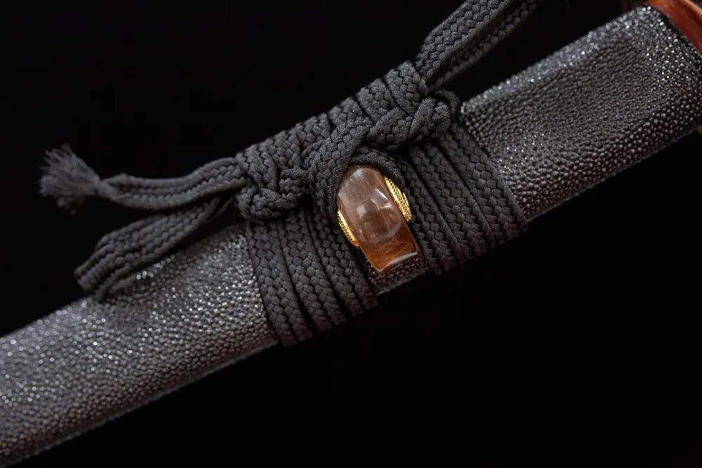 Thick coarse‑cotton braided sageo cord alloy fitting macro close‑up