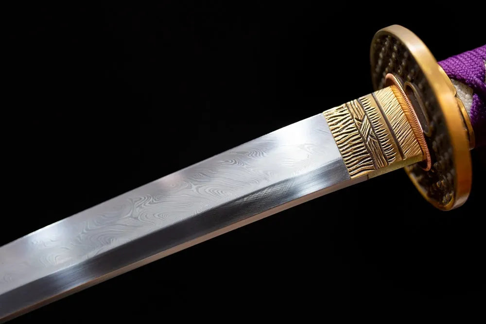 Upper T10 clay‑tempered katana blade brass habaki clean suguha straight‑even hamon temper‑line macro close‑up