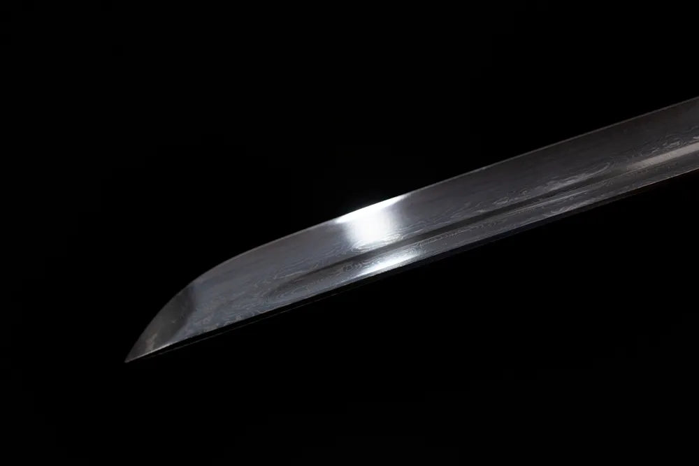 Classic functional katana‑style kissaki tip of Melanitis‑Katana blade close‑up view