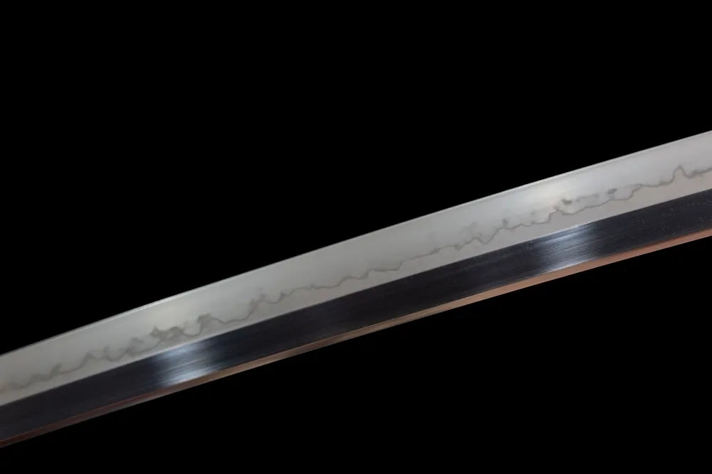Mid‑section natural wavy hamon temper‑line steel blade surface texture close‑up shot