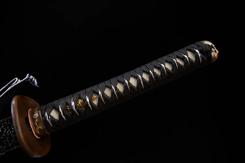 Full black woven tsuka gold leaf menuki front view