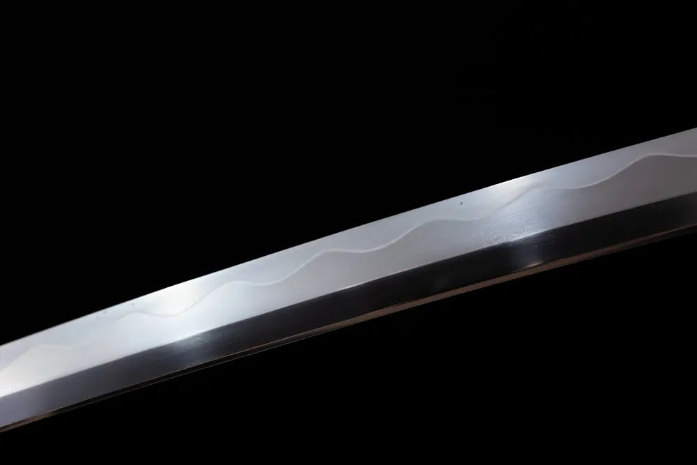Mid‑section gunome‑suguha layered‑chrysanthemum‑petal‑pattern hamon steel tachi blade surface close‑up shot