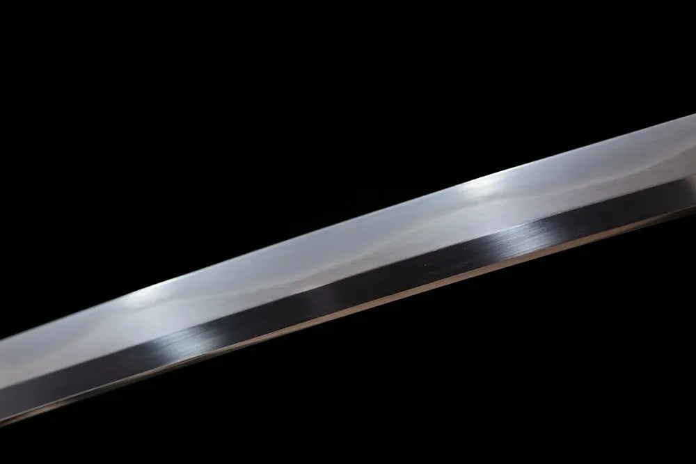 Mid‑section midare‑gunome surging‑dragon‑roiling‑pattern hamon steel katana blade surface close‑up shot
