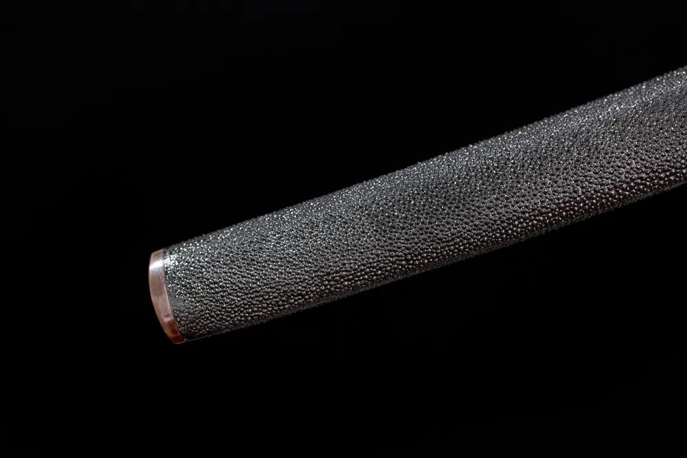 Bottom solid‑wood wrapped‑real‑fish‑skin saya ox‑horn kojiri end‑cap close‑up